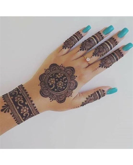 Dainty Crown Back Hand Mehndi Design Look